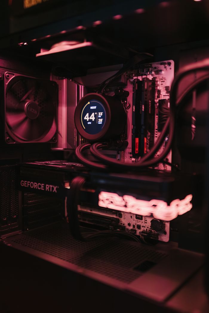 Mastering the First Impression: Your intriguing post title goes here Detailed view of a gaming PC build showcasing high-performance components and cooling system.